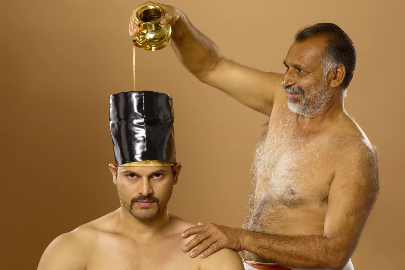 Medicated oil held on the scalp for the nervous system